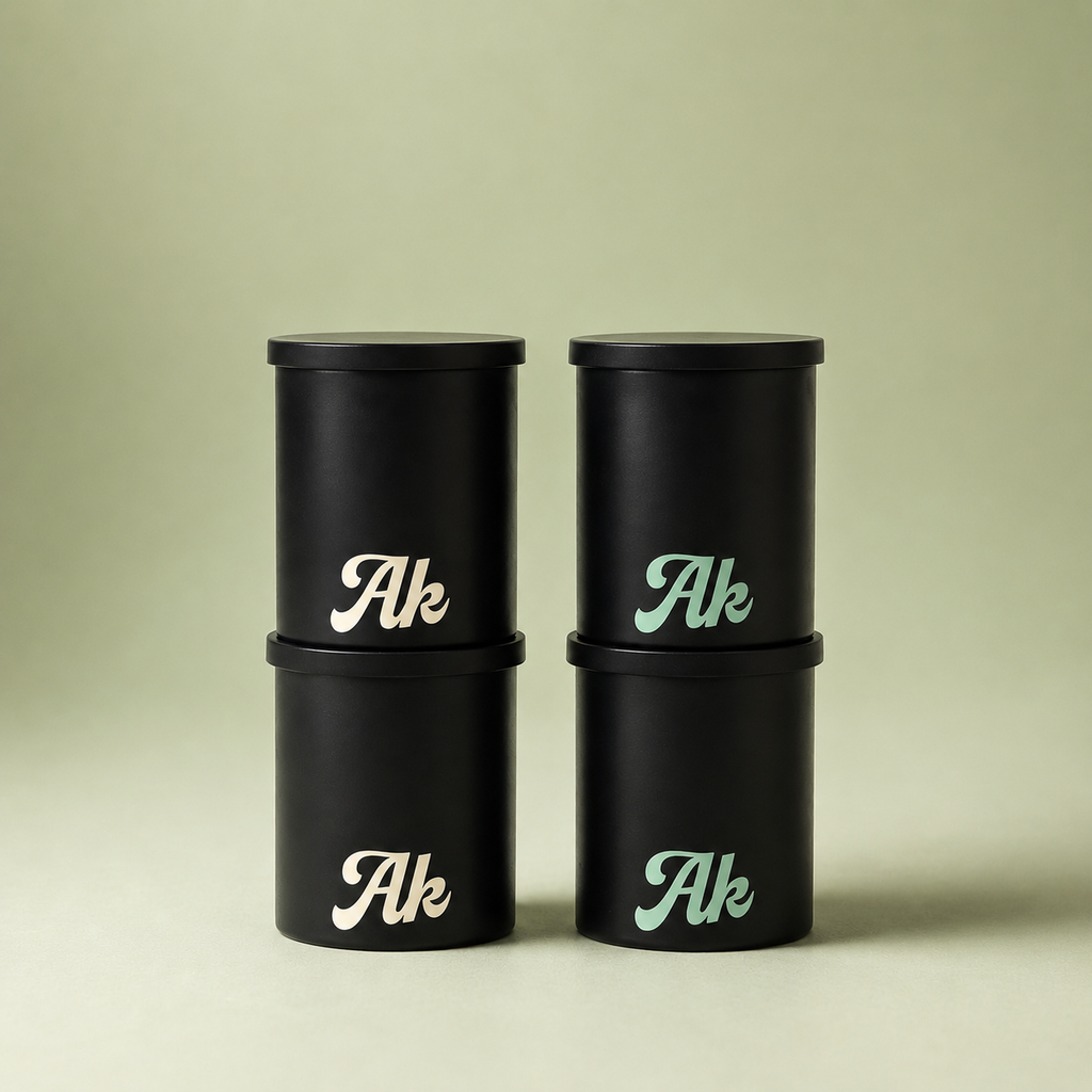 Personal air filter replacement cartridges bundle by Akcomplice & Co., featuring sleek black containers.